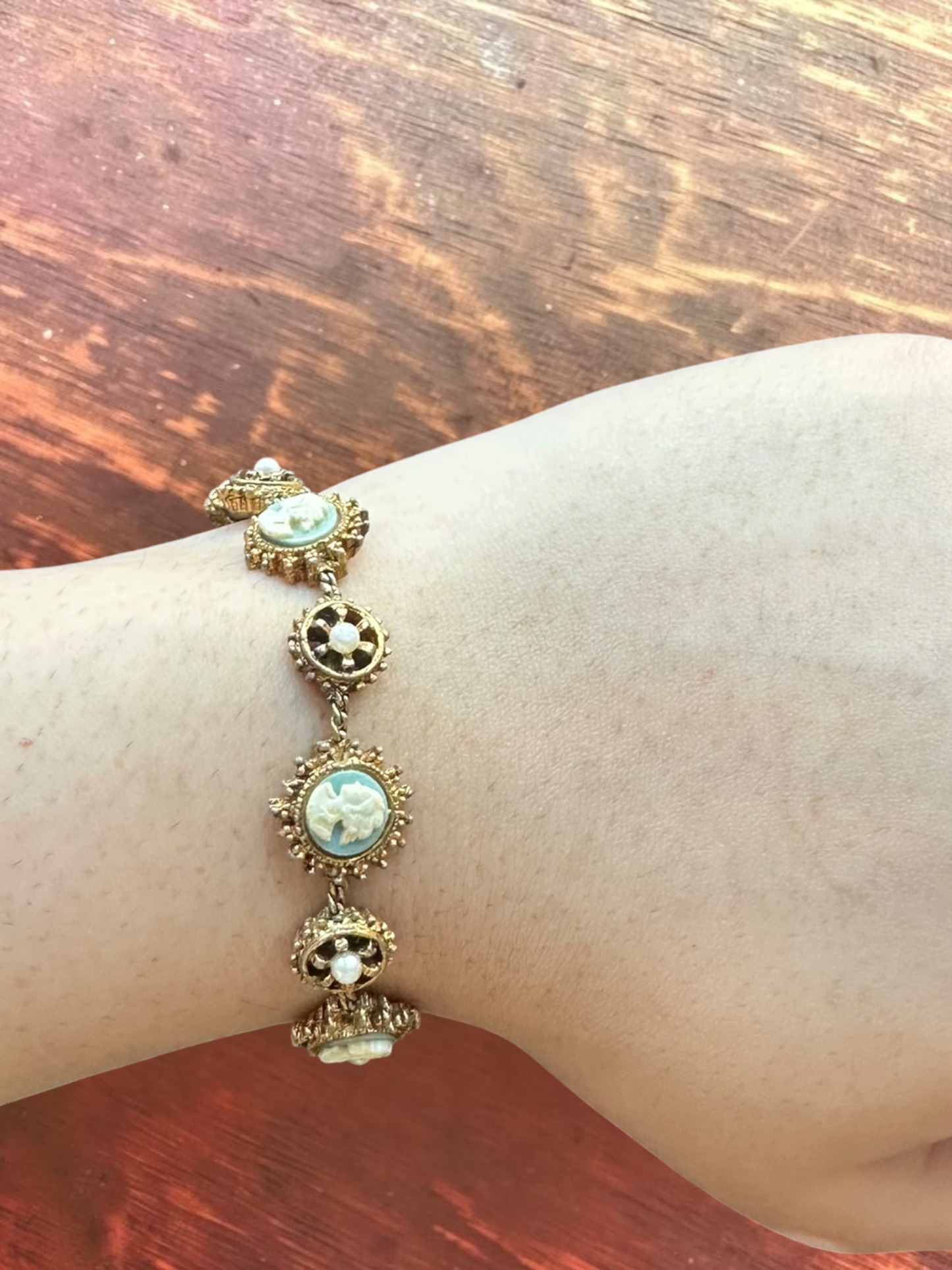 Vintage real cameo gold tone link bracelet worn on wrist