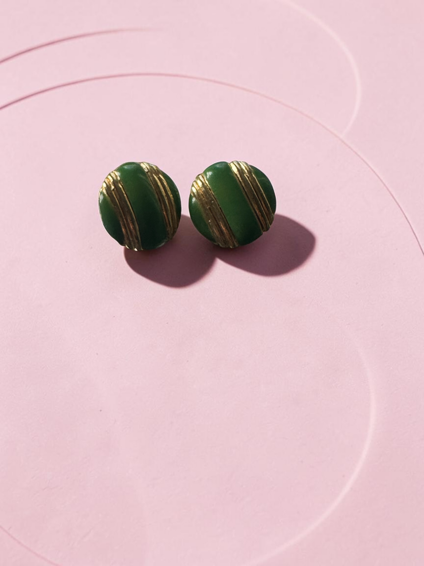 Vintage green and gold dome stud earrings - pair on pink background