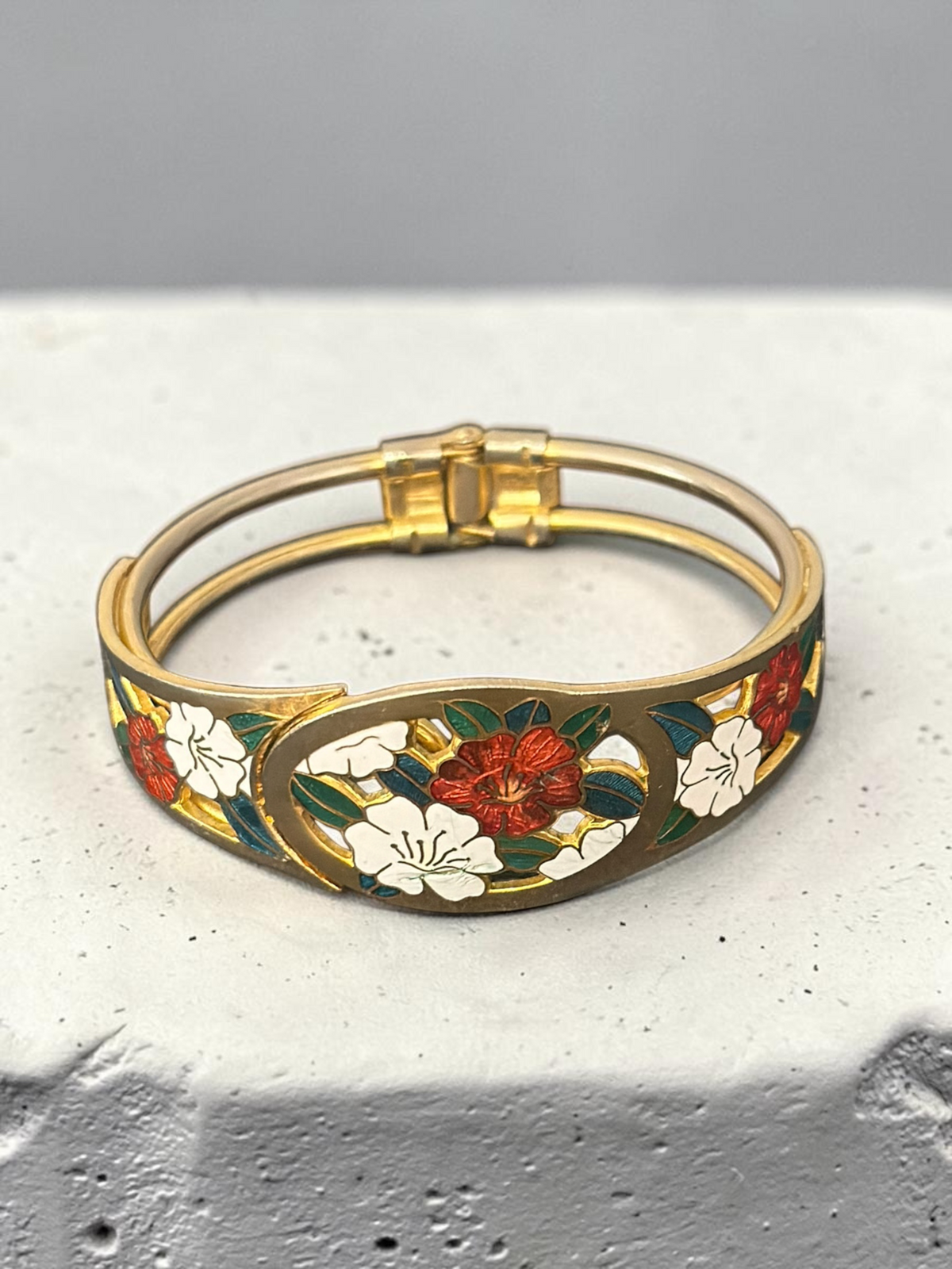 Cloisonné floral bangle flat lay with clasp visible