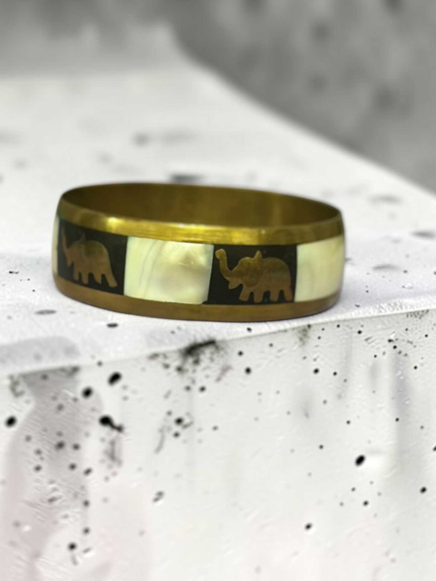 Camel mother of pearl bangle flat lay