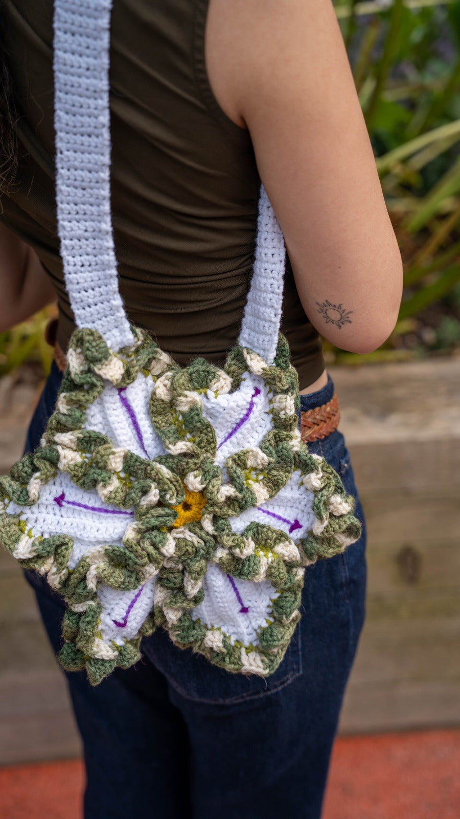 Handmade crochet flower bag - back view on model