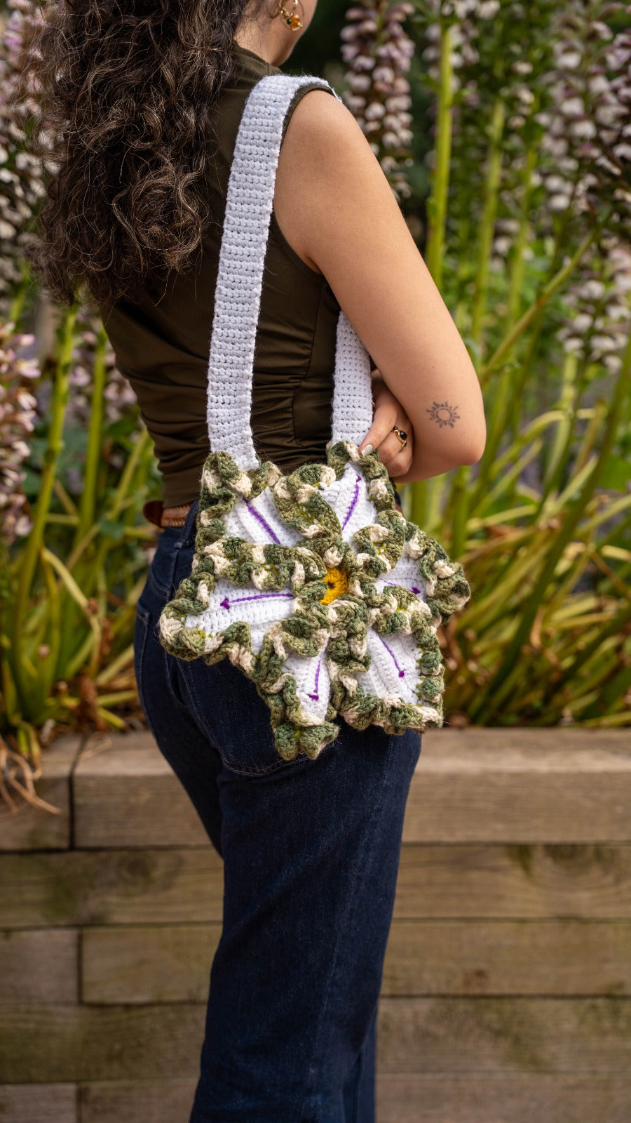 Handmade crochet flower bag - side view on model